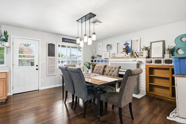 a view of a dining room with furniture window and wooden floor