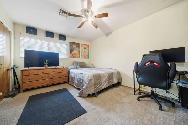 a bedroom with a bed and furniture