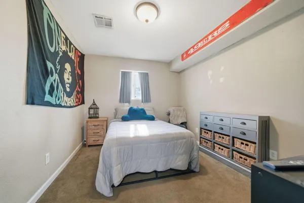 a bedroom with a bed and a cabinets