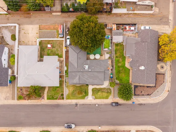 an aerial view of residential house with outdoor space and swimming pool