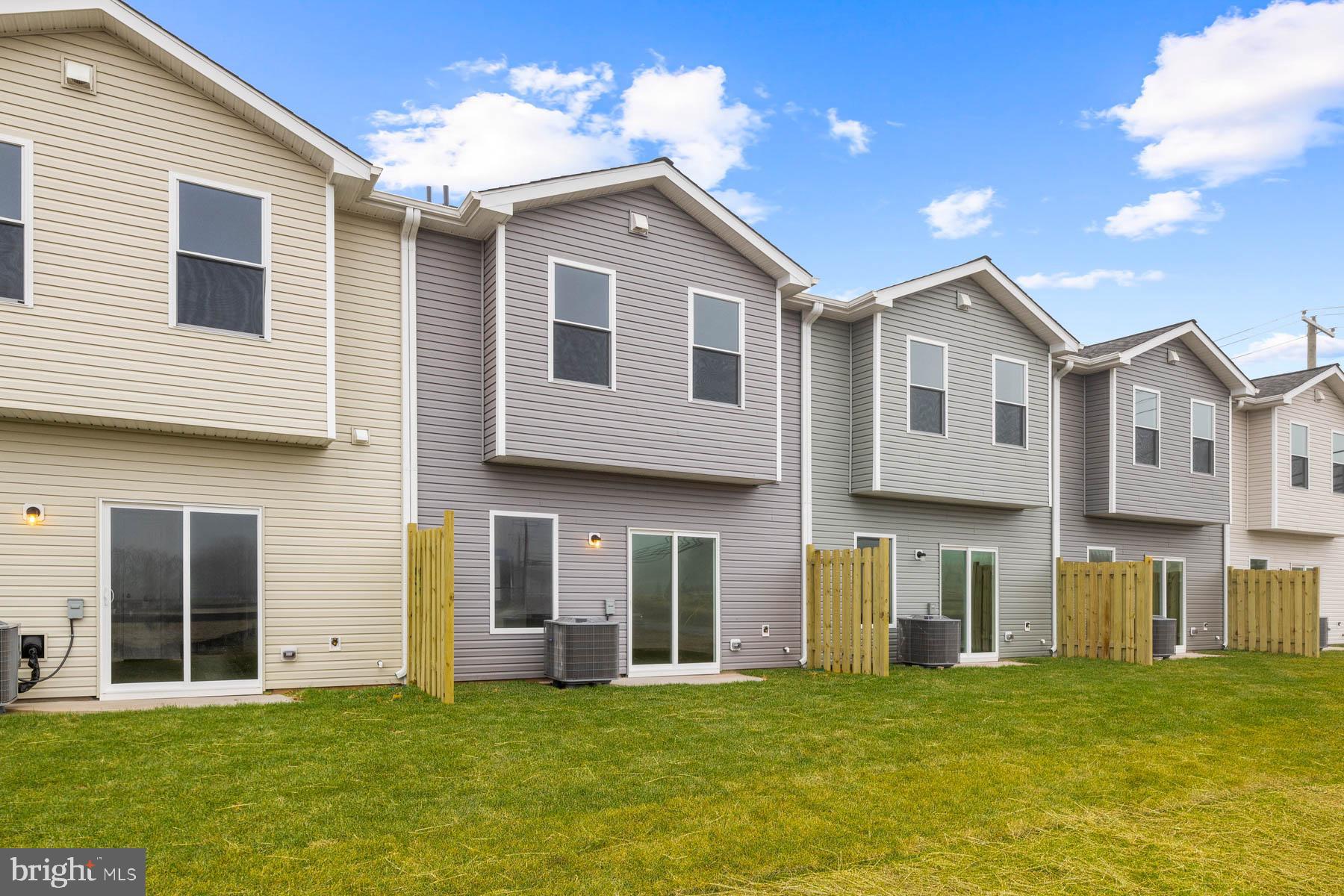 8151 Bartholomew Court Baltimore, MD 21206 - Photo 3 of 15 a big house with a big yard and large trees