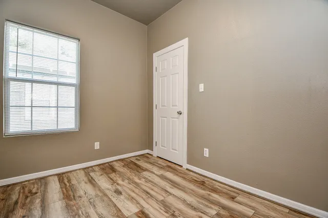 an empty room with a empty space and a window