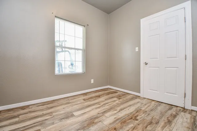 a view of a chairs and table in the balcony