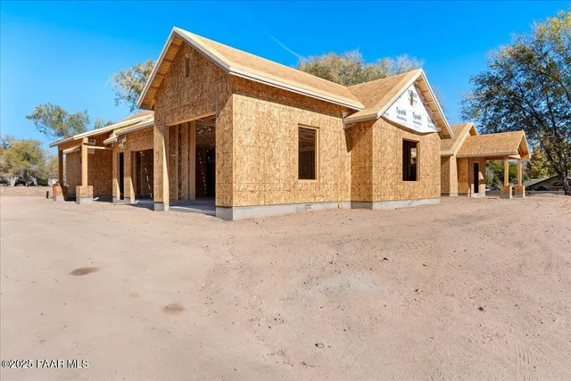a front view of a house with a outdoor space
