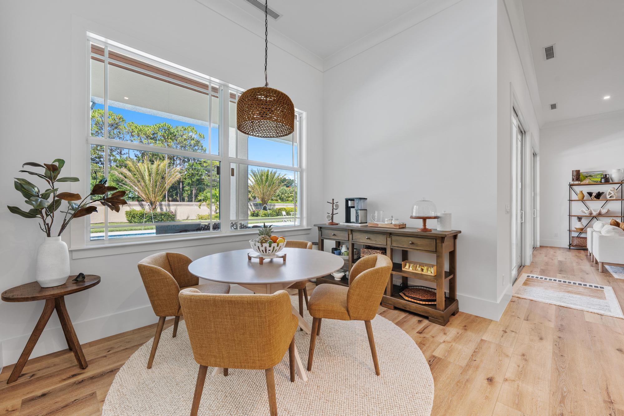 19993 Loxahatchee Pointe Drive Jupiter, FL 33458 - Photo 12 of 42 a view of a dining room with furniture window and outside view