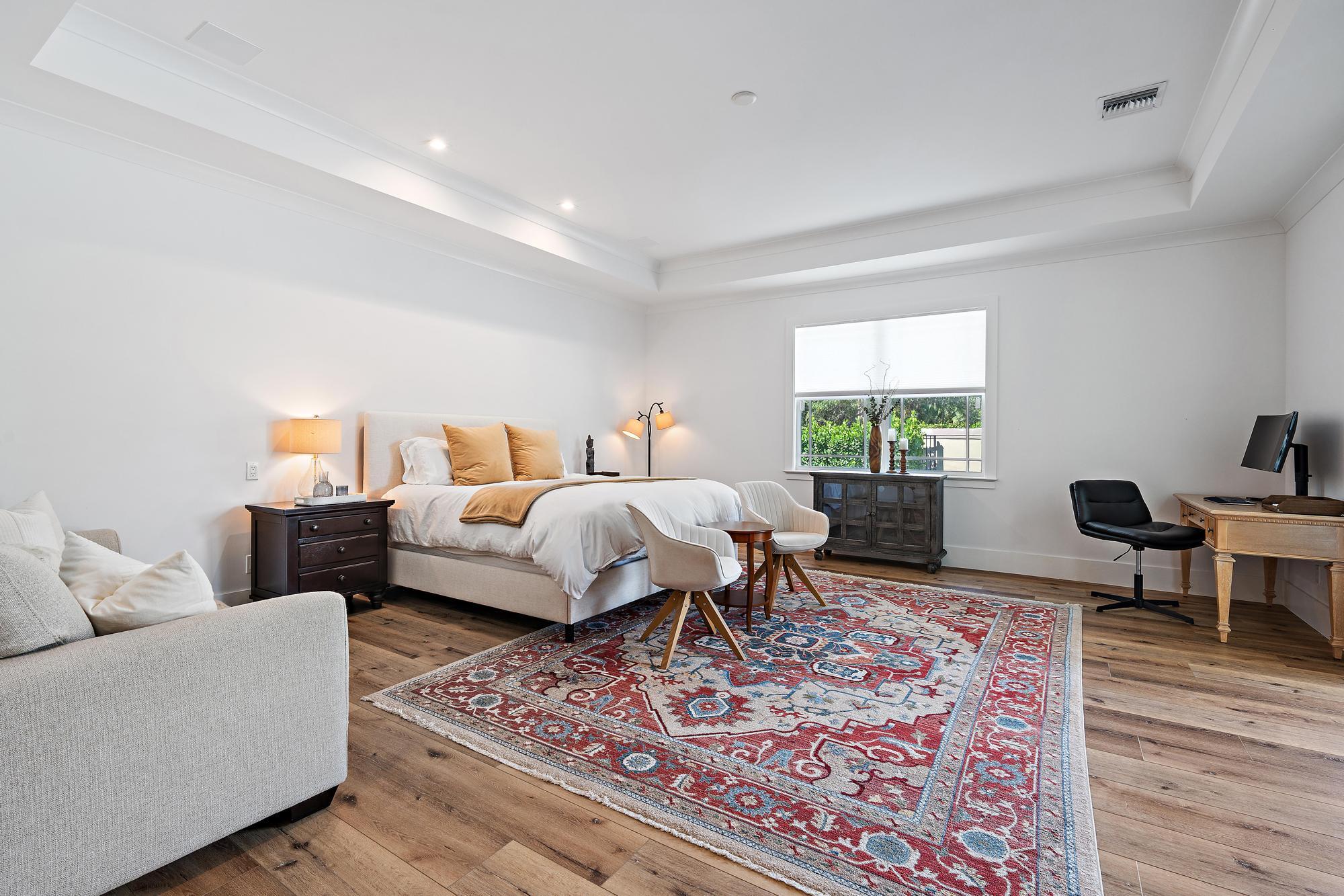 19993 Loxahatchee Pointe Drive Jupiter, FL 33458 - Photo 13 of 42 a bedroom with furniture and a rug