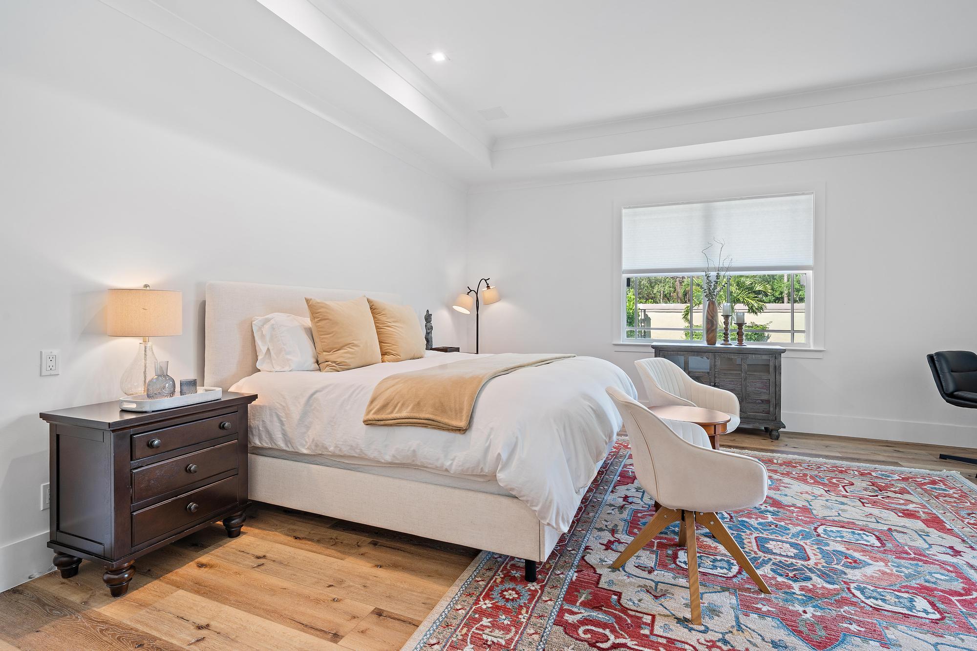 19993 Loxahatchee Pointe Drive Jupiter, FL 33458 - Photo 15 of 42 a bed room with a bed and a lamp