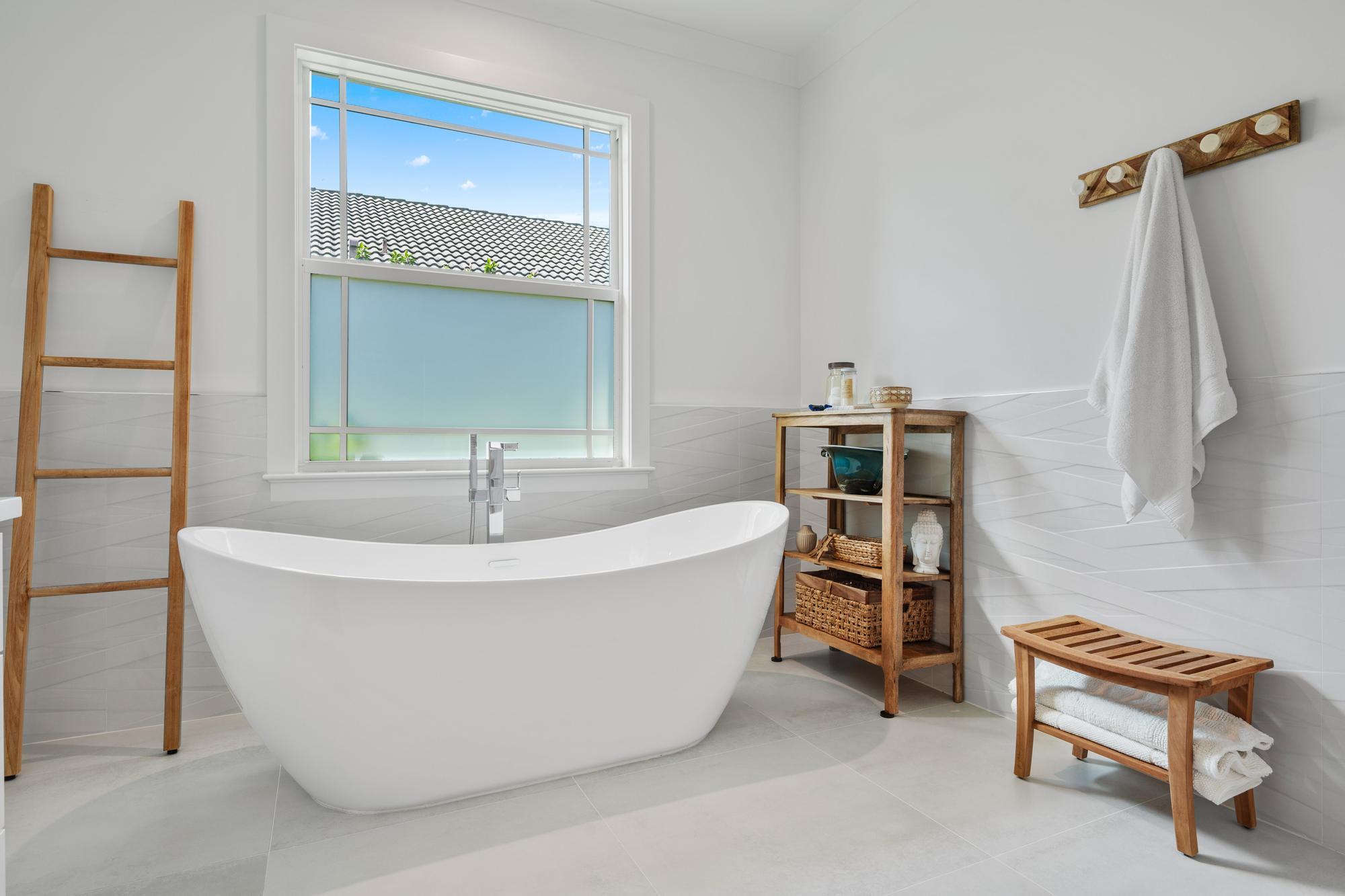 19993 Loxahatchee Pointe Drive Jupiter, FL 33458 - Photo 20 of 42 a white bath tub sitting in a bathroom