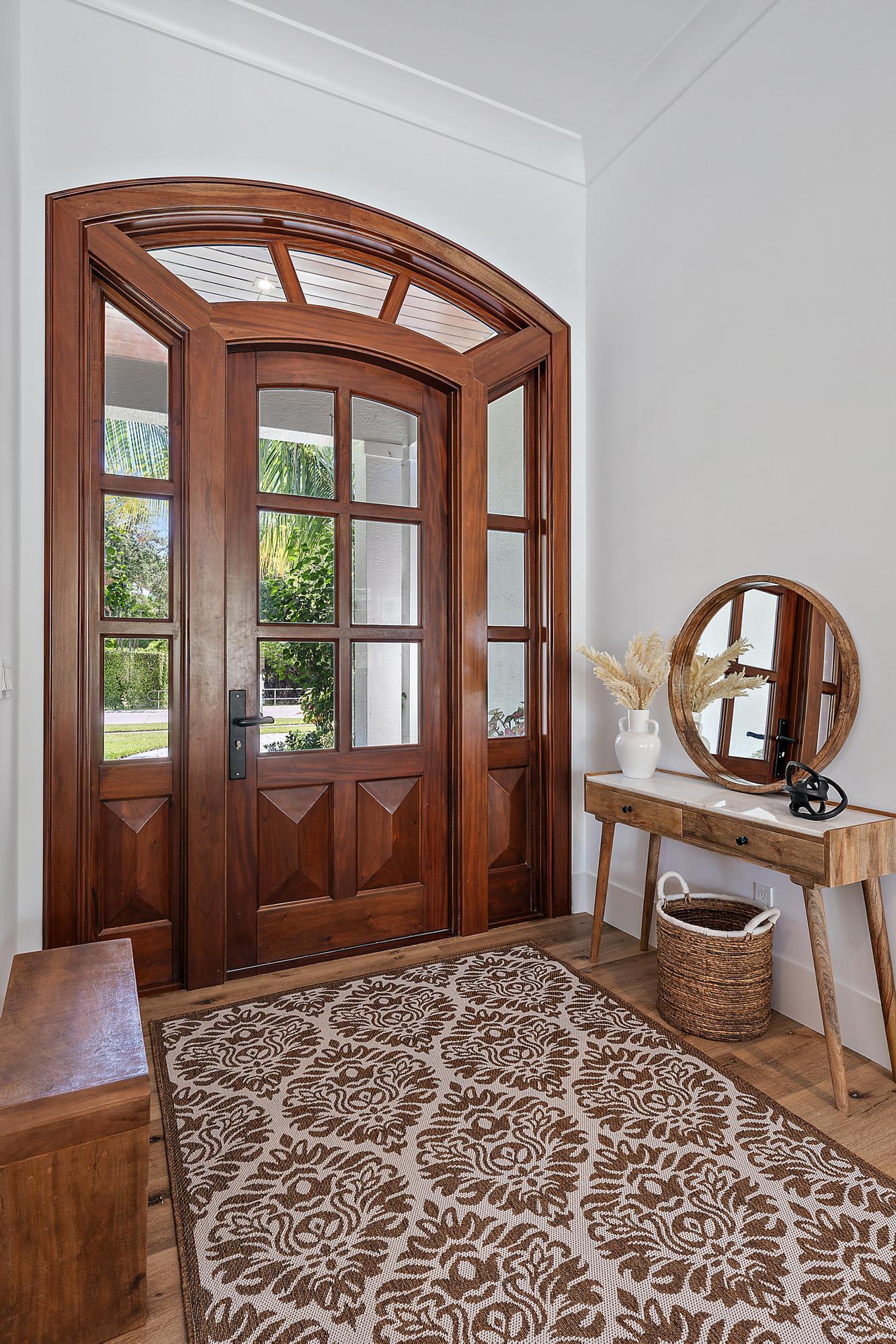 19993 Loxahatchee Pointe Drive Jupiter, FL 33458 - Photo 2 of 42 a bedroom with a bed and a dresser next to a window