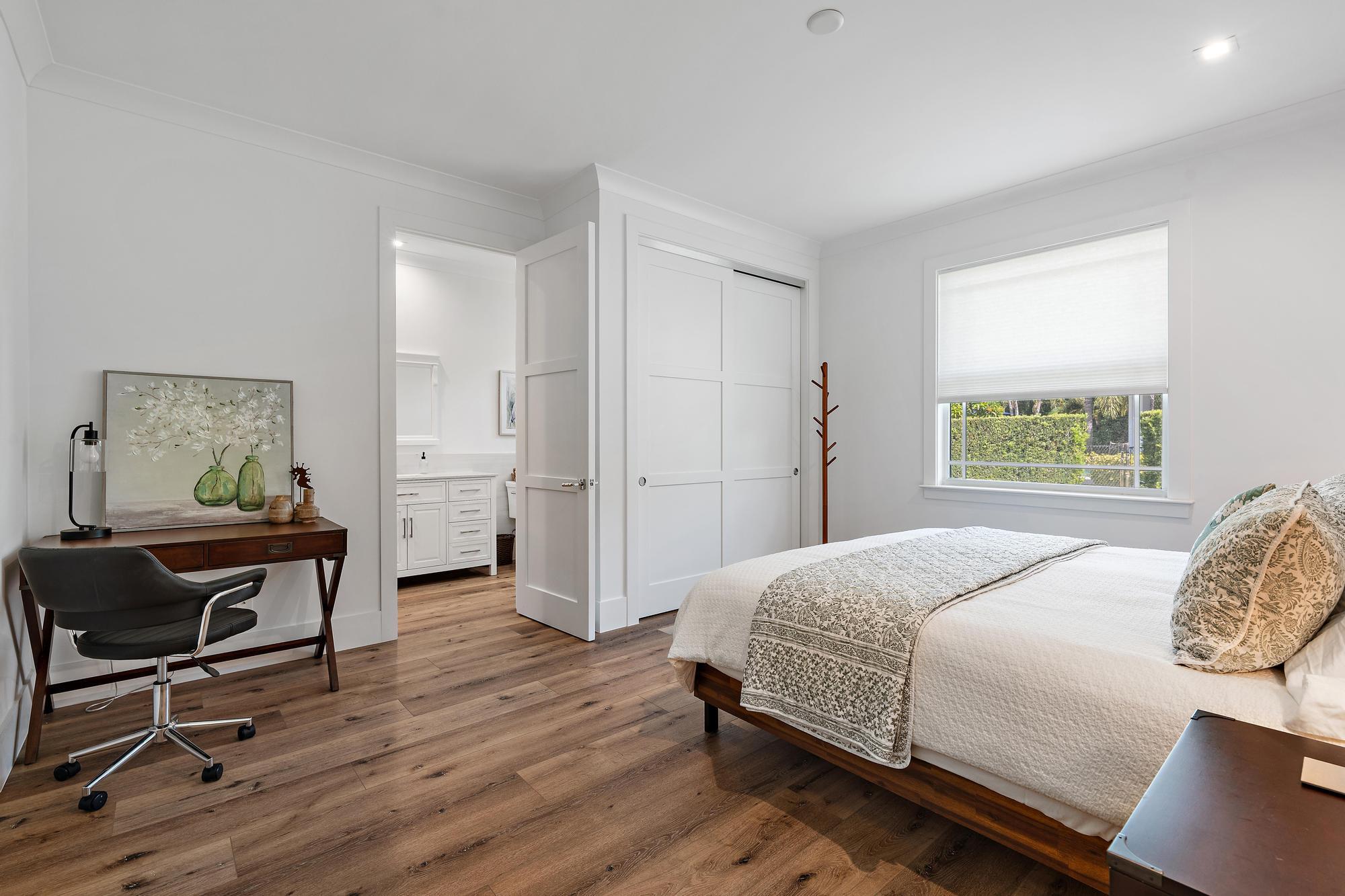 19993 Loxahatchee Pointe Drive Jupiter, FL 33458 - Photo 25 of 42 a bedroom with a bed and a window