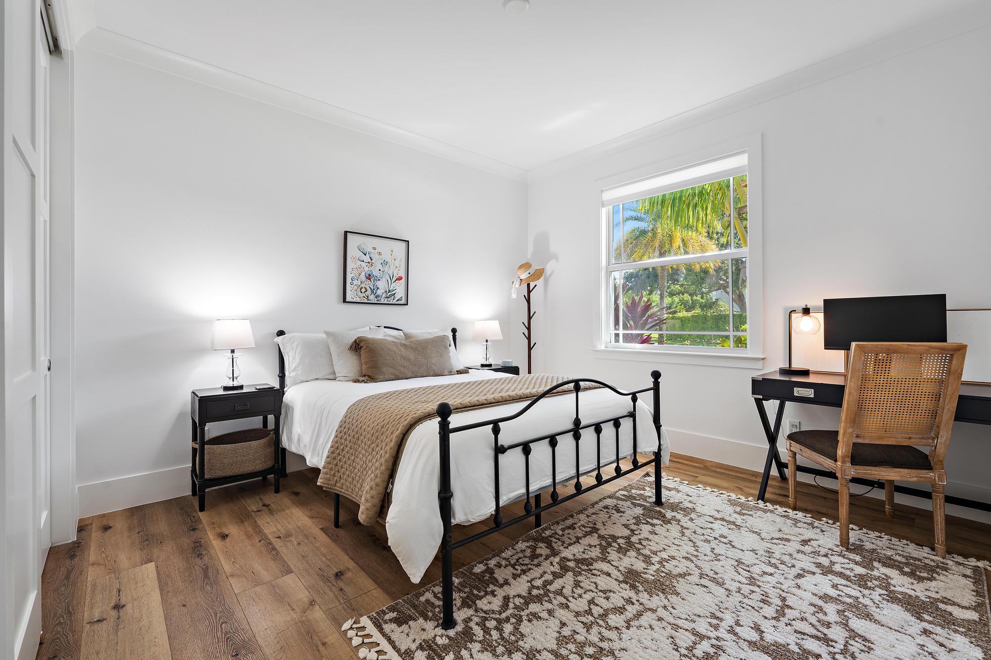 19993 Loxahatchee Pointe Drive Jupiter, FL 33458 - Photo 27 of 42 a bedroom with a bed and a desk in it