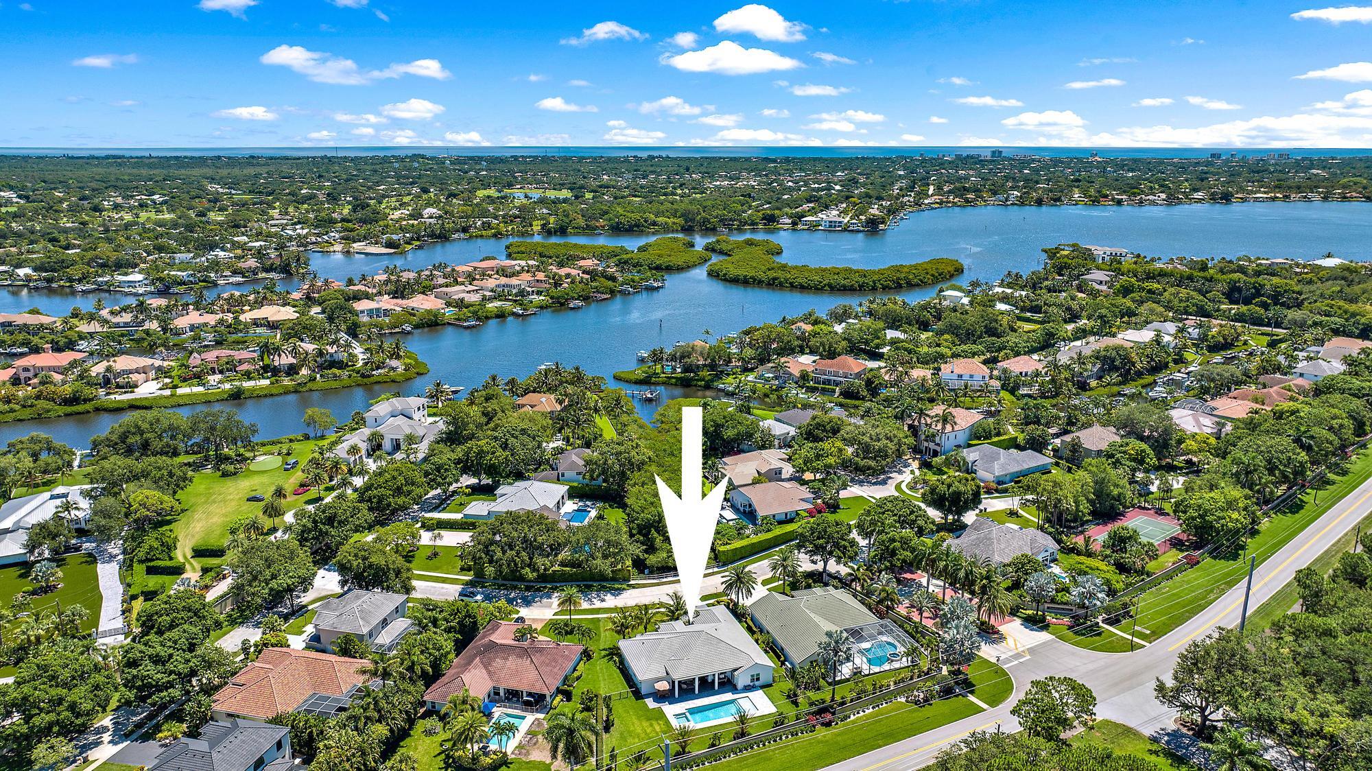 19993 Loxahatchee Pointe Drive Jupiter, FL 33458 - Photo 34 of 42 an aerial view of a houses with a lake and lake view