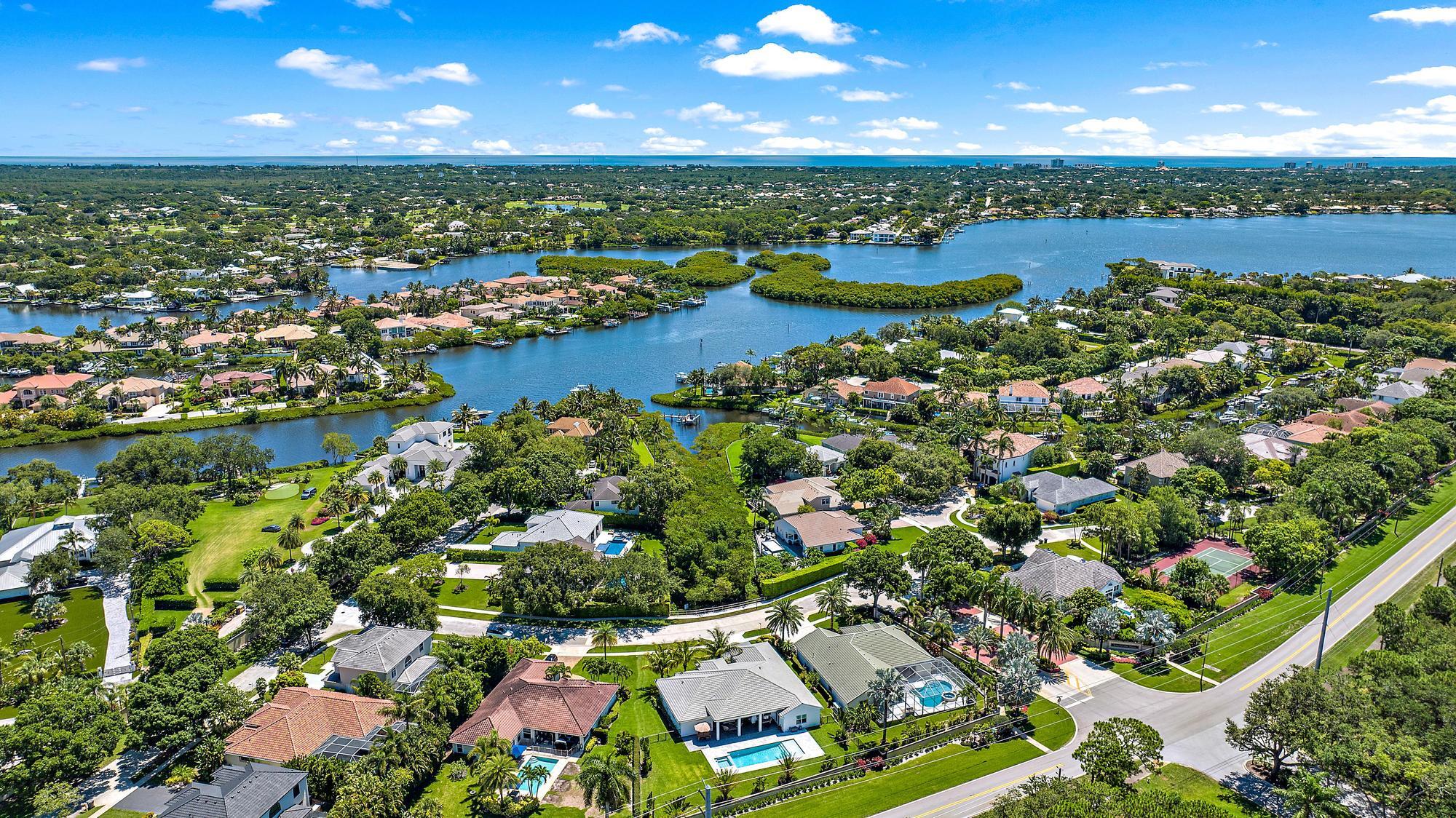 19993 Loxahatchee Pointe Drive Jupiter, FL 33458 - Photo 35 of 42 a view of a lake with a city