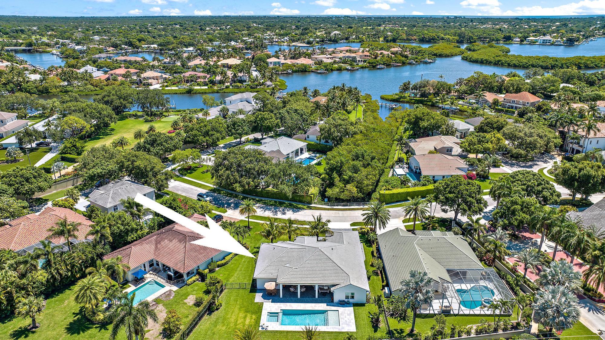 19993 Loxahatchee Pointe Drive Jupiter, FL 33458 - Photo 39 of 42 an aerial view of residential houses with outdoor space and lake view