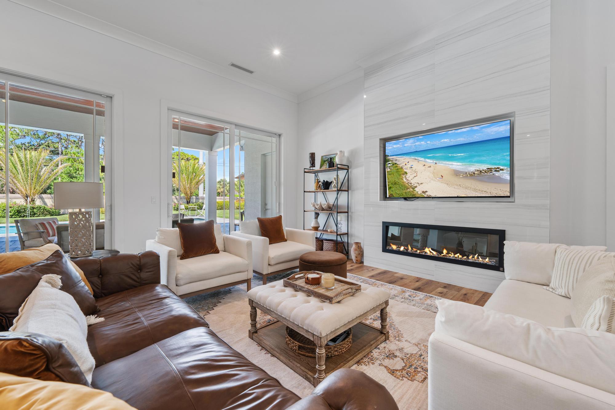 19993 Loxahatchee Pointe Drive Jupiter, FL 33458 - Photo 9 of 42 a living room with furniture a rug and a large window