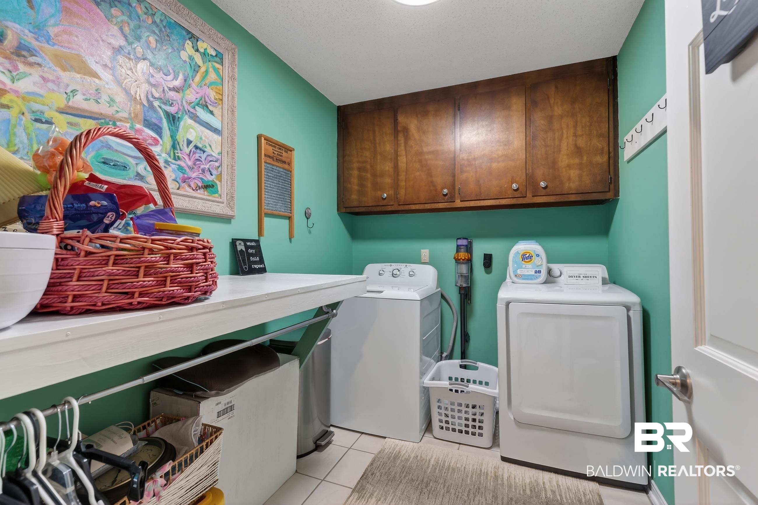 1271 Spring Valley Drive South Mobile, AL 36693 - Photo 23 of 56 Laundry room featuring independent washer and dryer, light tile patterned floors, and cabinet space