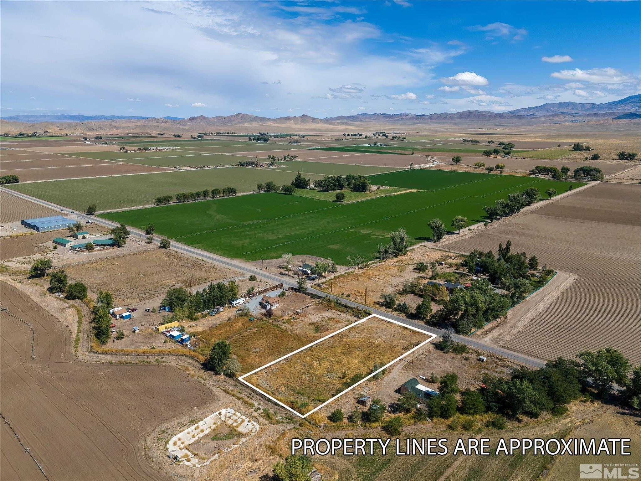 Mac MacKenzie Lane Yerington, NV 89447 - Photo 1 of 24 an aerial view of a house with a garden