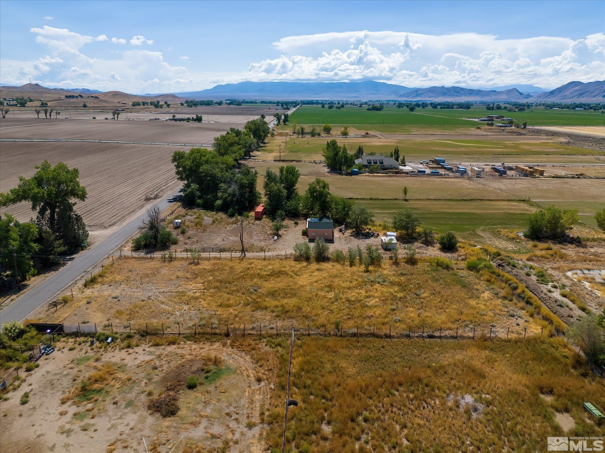 Mac MacKenzie Lane Yerington, NV 89447 - Photo 5 of 24 a view of a lake with houses in the back