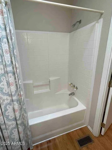 a bathroom with a granite countertop toilet a sink and a mirror