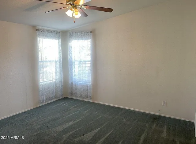 a bathroom view of a toilet and a shower