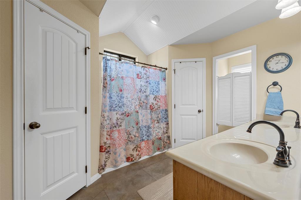 900 Elizabeth Drive Robinson, TX 76706 - Photo 14 of 35 a bathroom with a sink and a mirror