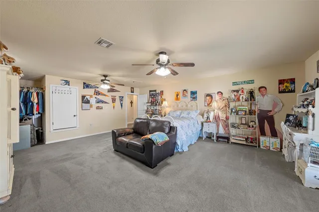 a view of a livingroom with furniture and white walls