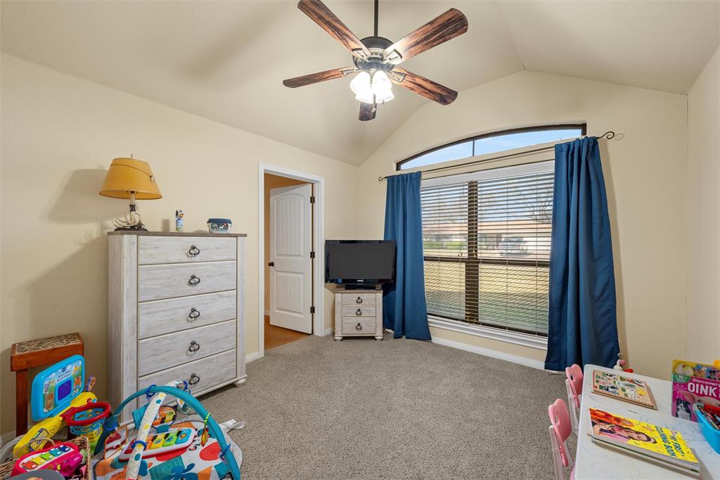 900 Elizabeth Drive Robinson, TX 76706 - Photo 21 of 35 a living room with furniture and a baby crib