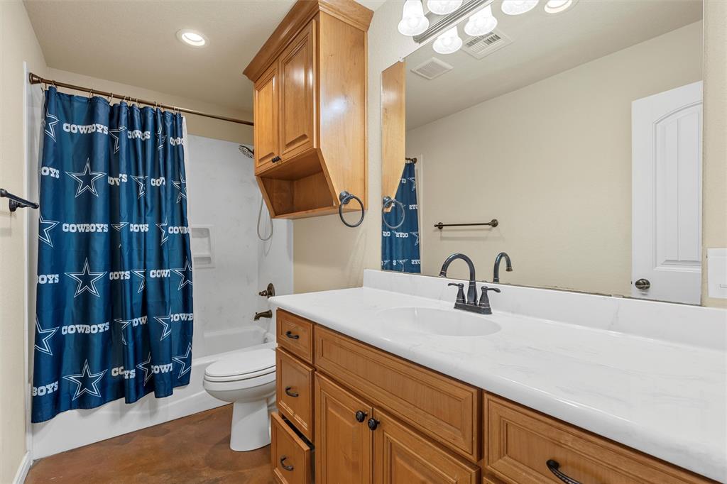 900 Elizabeth Drive Robinson, TX 76706 - Photo 25 of 35 a bathroom with a sink a toilet and shower
