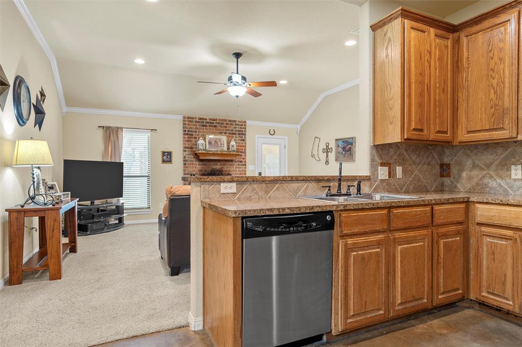 900 Elizabeth Drive Robinson, TX 76706 - Photo 10 of 35 a kitchen with a stove a sink and a refrigerator