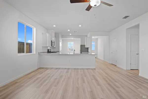 a view of kitchen with wooden floor and window