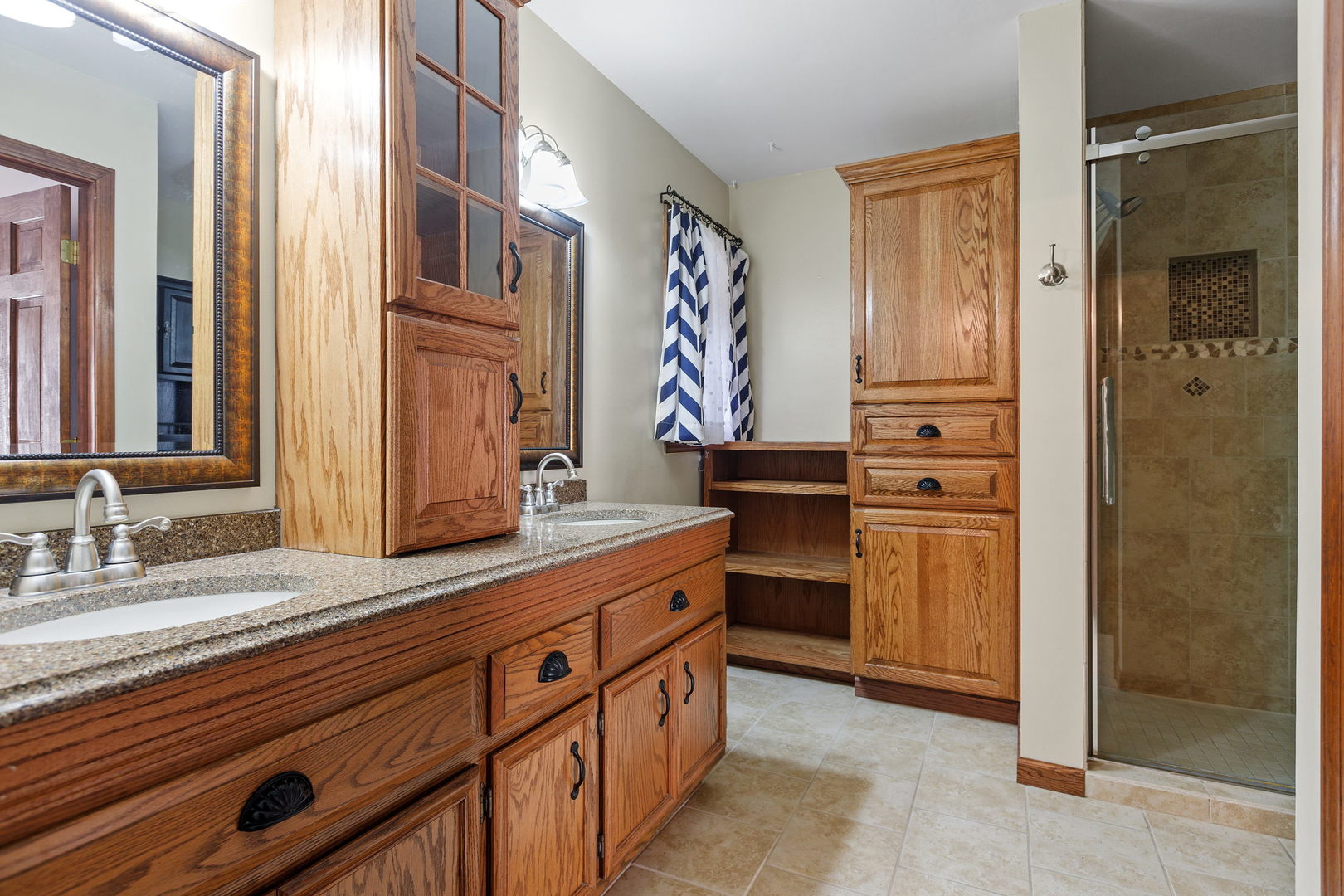 360 East Southmor Road Morris, IL 60450 - Photo 14 of 36 a spacious bathroom with a double vanity sink and a mirror