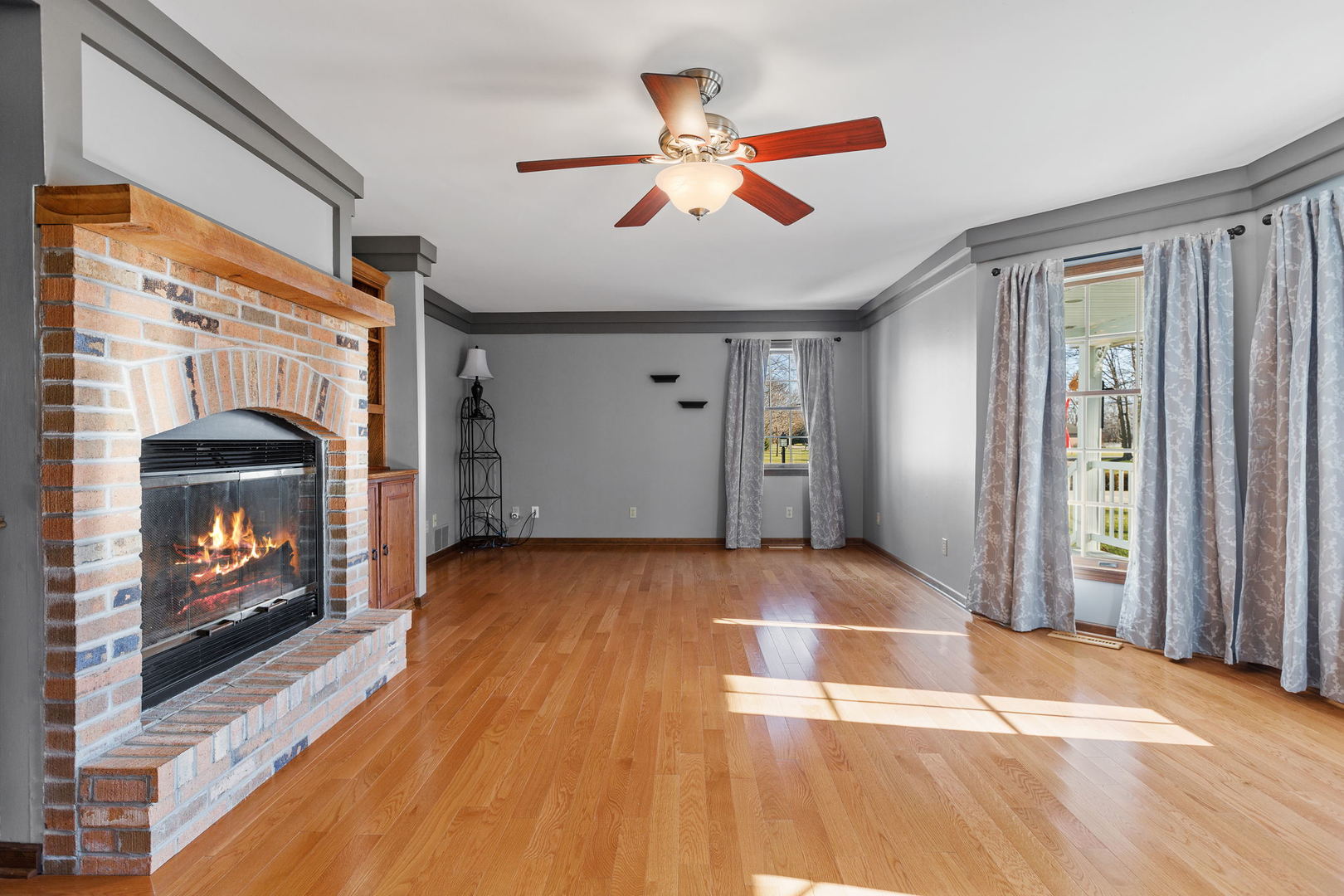 360 East Southmor Road Morris, IL 60450 - Photo 4 of 36 a view of empty room with fireplace and fan