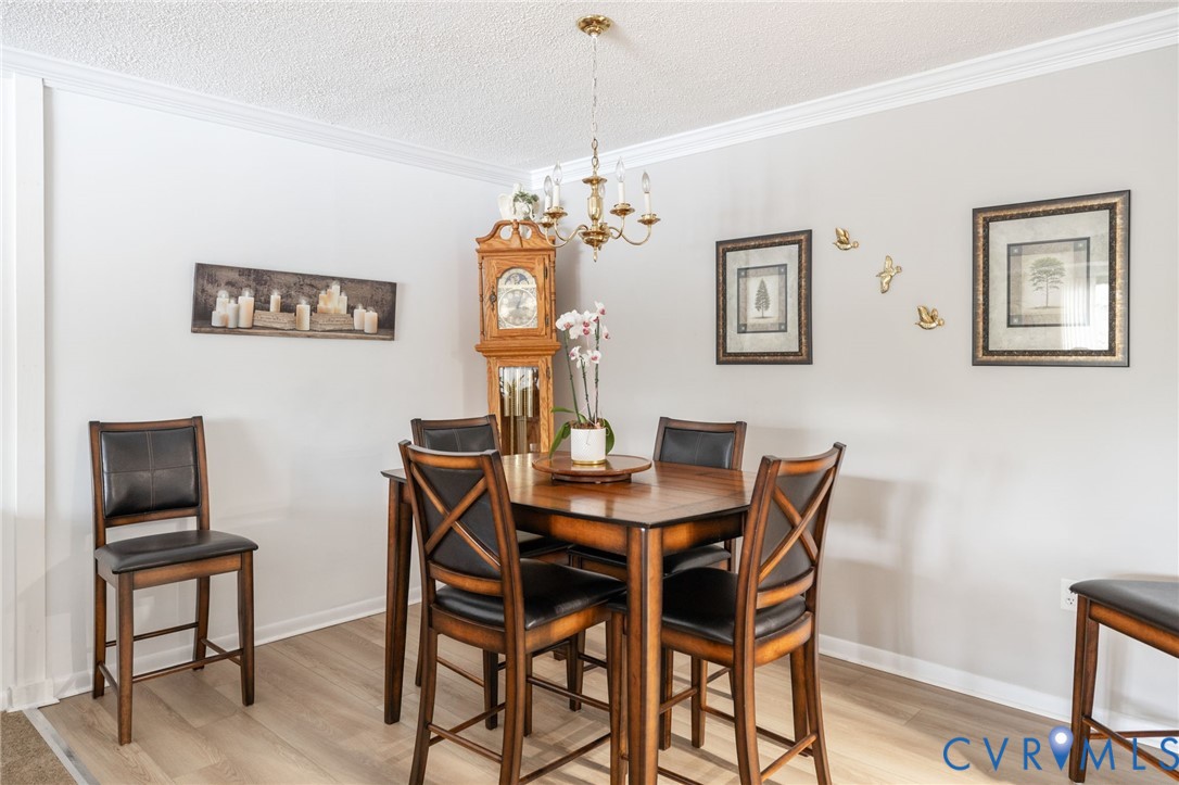 2956 Hathaway Road, Unit U104 Richmond, VA 23225 - Photo 9 of 42 a view of a dining room with furniture and wooden floor