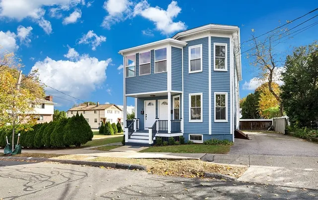 a front view of a house with a yard