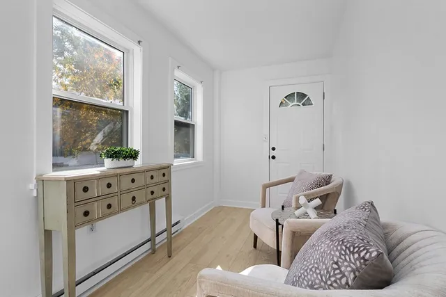 a living room with furniture and window