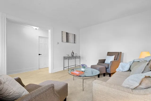 a living room with furniture and a table