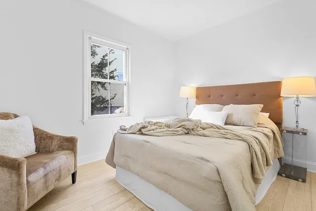 a bedroom with a bed and a couch