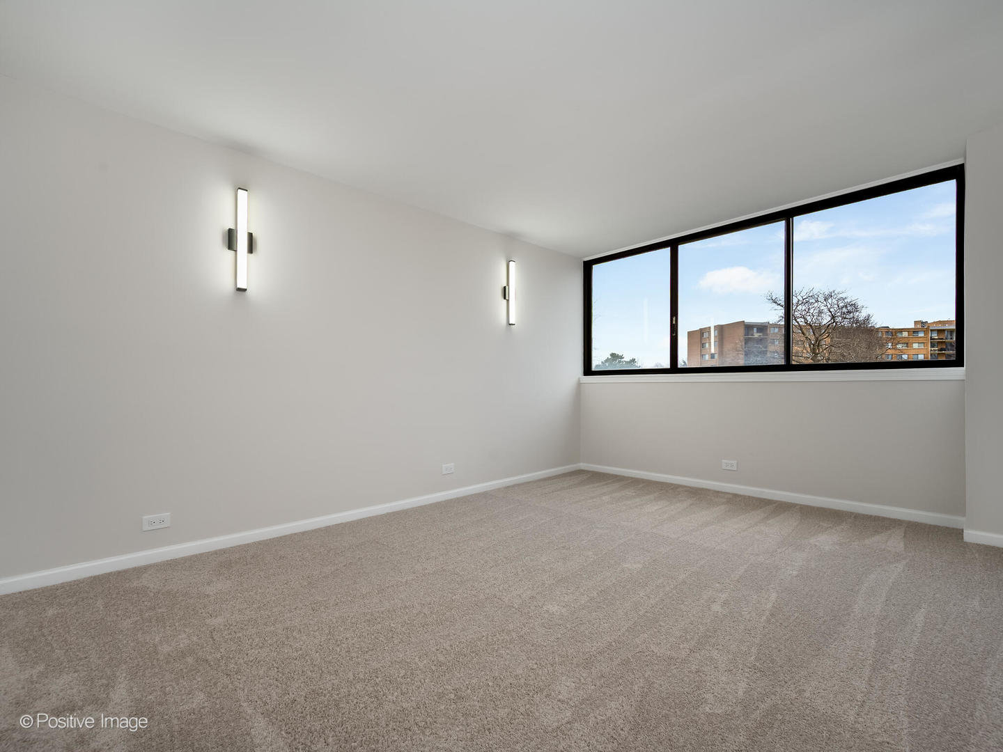 101 Bar Harbour Road, Unit 2M Schaumburg, IL 60193 - Photo 11 of 17 an empty room with windows