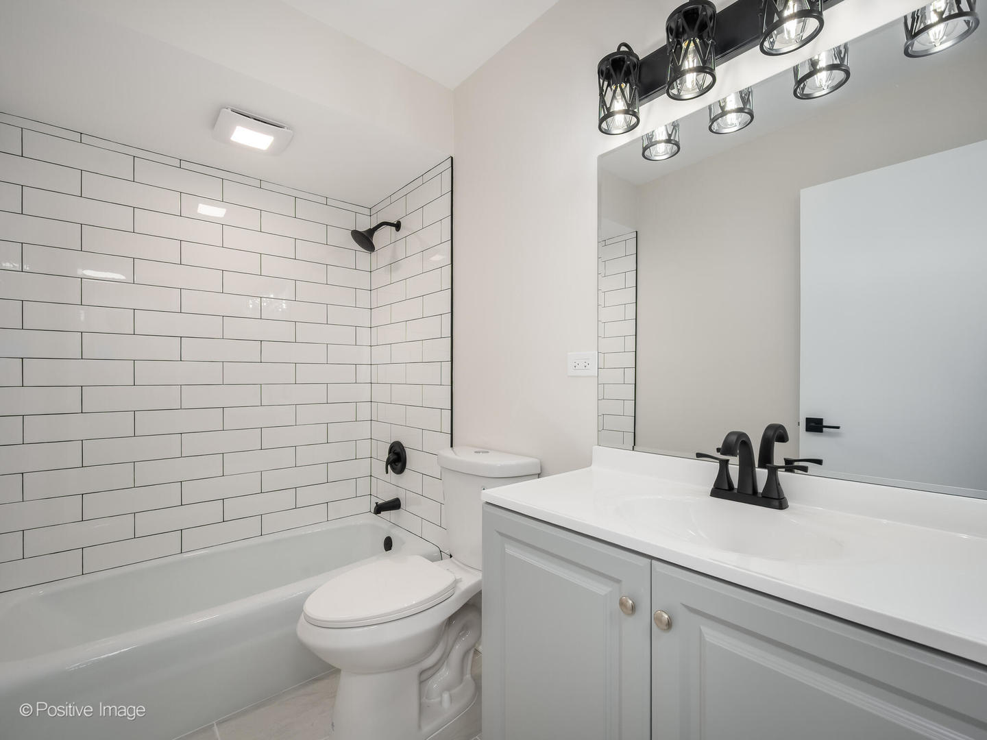 101 Bar Harbour Road, Unit 2M Schaumburg, IL 60193 - Photo 12 of 17 a bathroom with a sink a toilet a mirror and shower