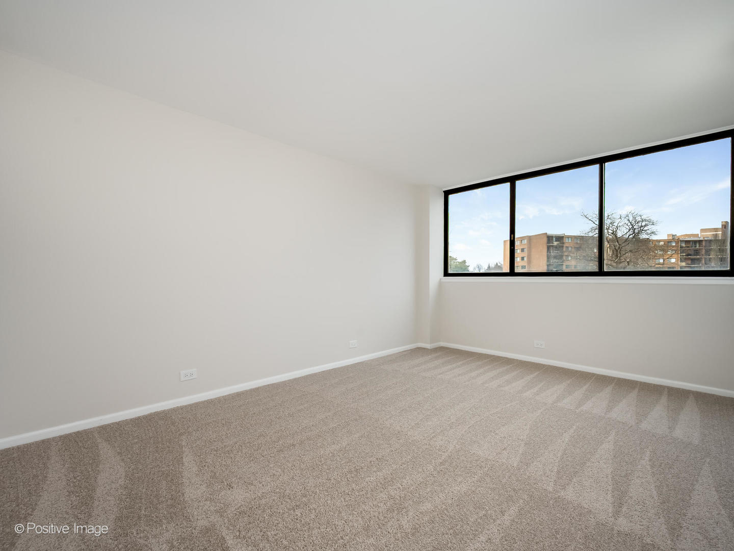 101 Bar Harbour Road, Unit 2M Schaumburg, IL 60193 - Photo 13 of 17 an empty room with a large window