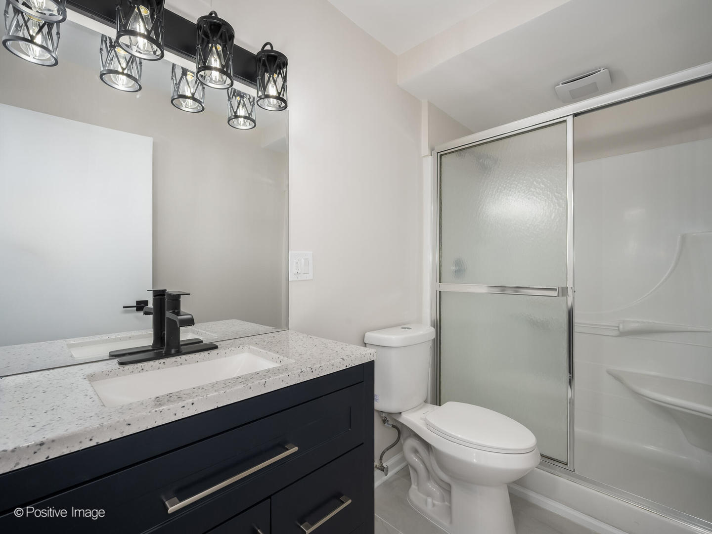 101 Bar Harbour Road, Unit 2M Schaumburg, IL 60193 - Photo 15 of 17 a bathroom with a sink a toilet and shower