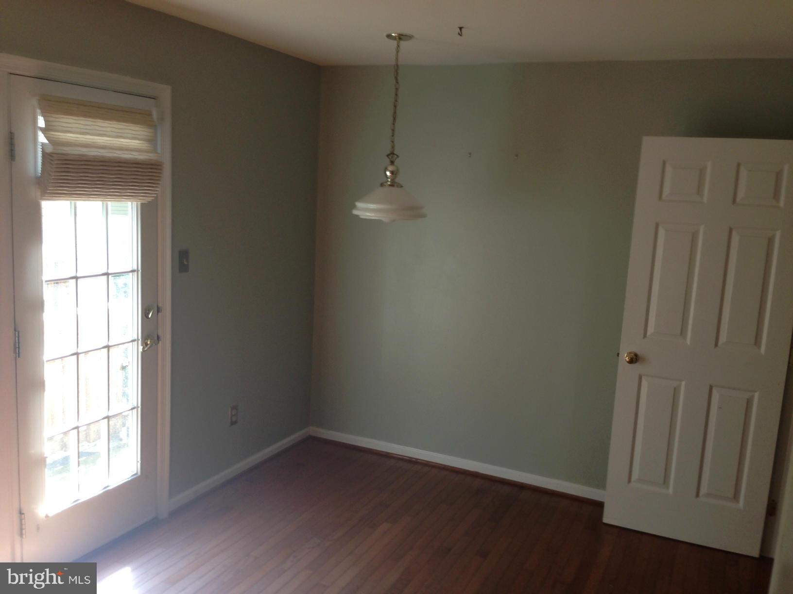 2180 South Glebe Road Arlington, VA 22204 - Photo 6 of 19 a view of a room with wooden floor and window
