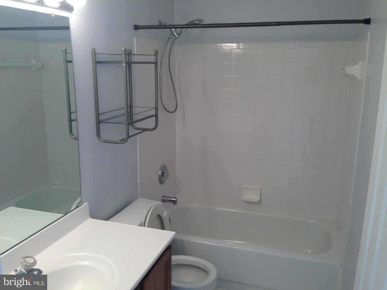 2180 South Glebe Road Arlington, VA 22204 - Photo 7 of 19 a bathroom with a shower and a toilet sink
