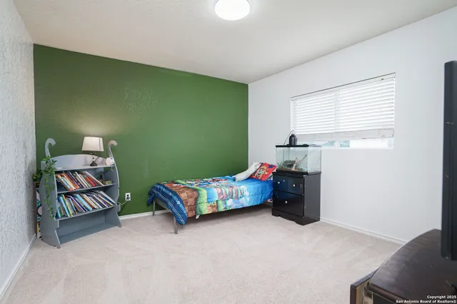 a bedroom with a bed and a dresser