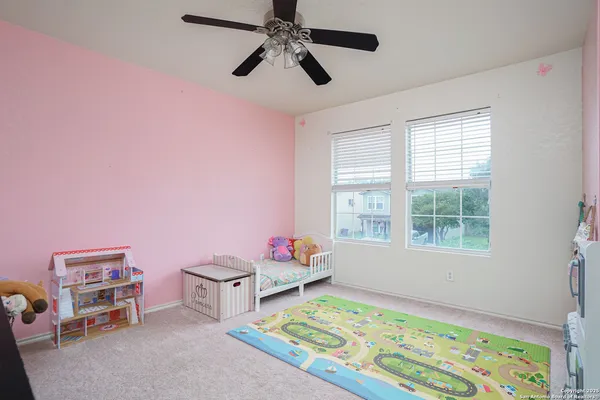 a bedroom with furniture and a window