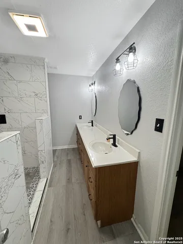 a bathroom with a sink and a mirror