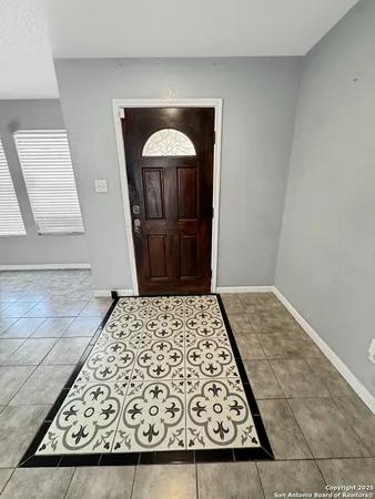 a view of house with yard and front view of a house