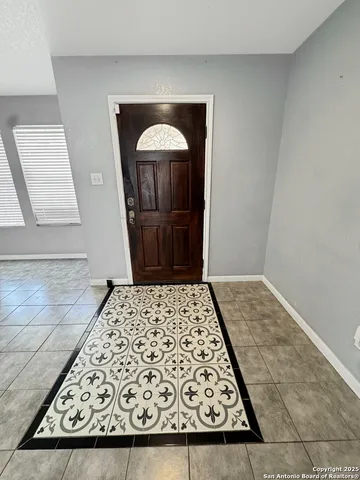 a view of house with yard and front view of a house
