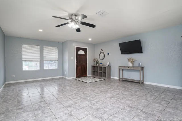 a view of a livingroom with a flat screen tv