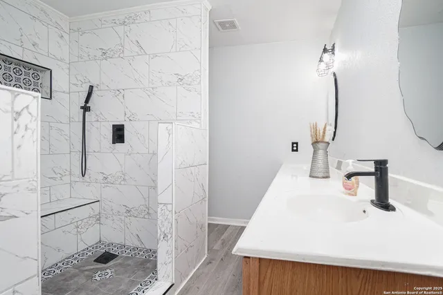 a bathroom with a sink and a mirror